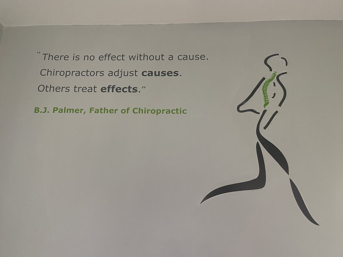 The practice mark and the Palmer quote on the waiting room wall